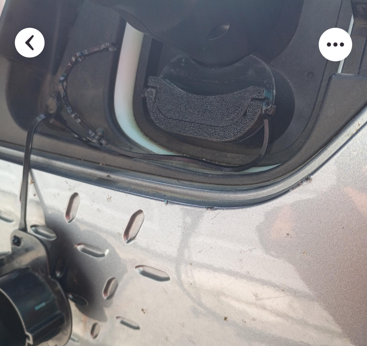 Electric vehicle charge port dust and moisture cover with low profile and swivel handle