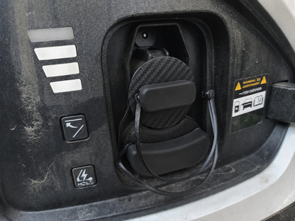 Electric vehicle charge port dust and moisture cover with low profile and swivel handle
